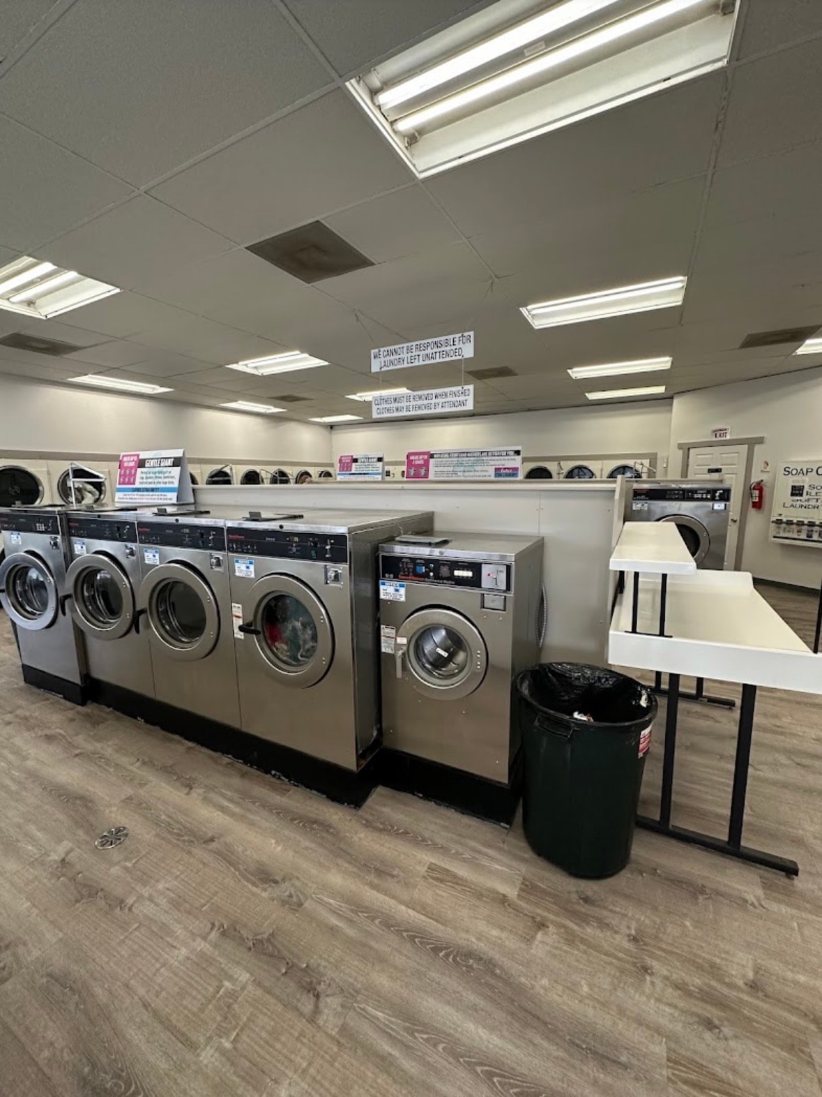 LuLu's Coin Laundry — stainless steel front-load washers and folding tables